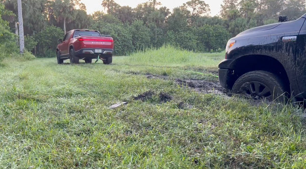 Rivian R1T rescues Toyota Tundra that’s been stuck in mud for two days